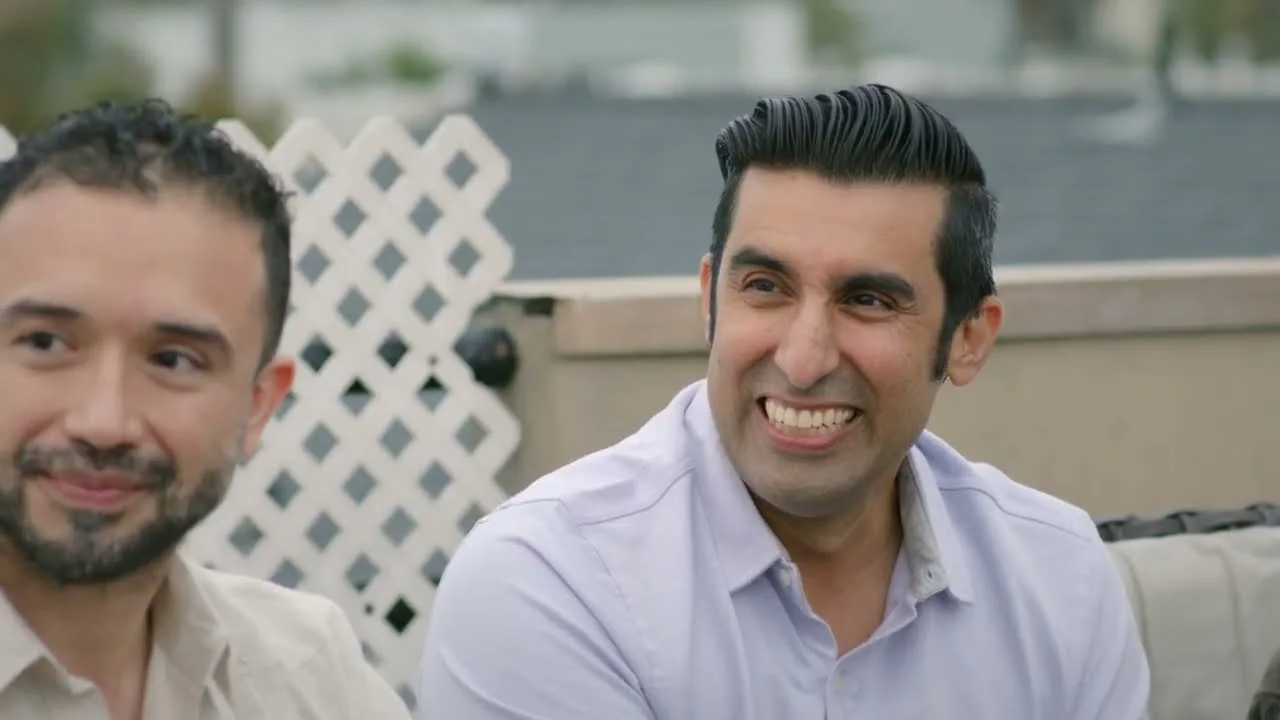 Two dads laughing together at a Los Angeles rooftop roundtable, from Grown Up Dad episode 4